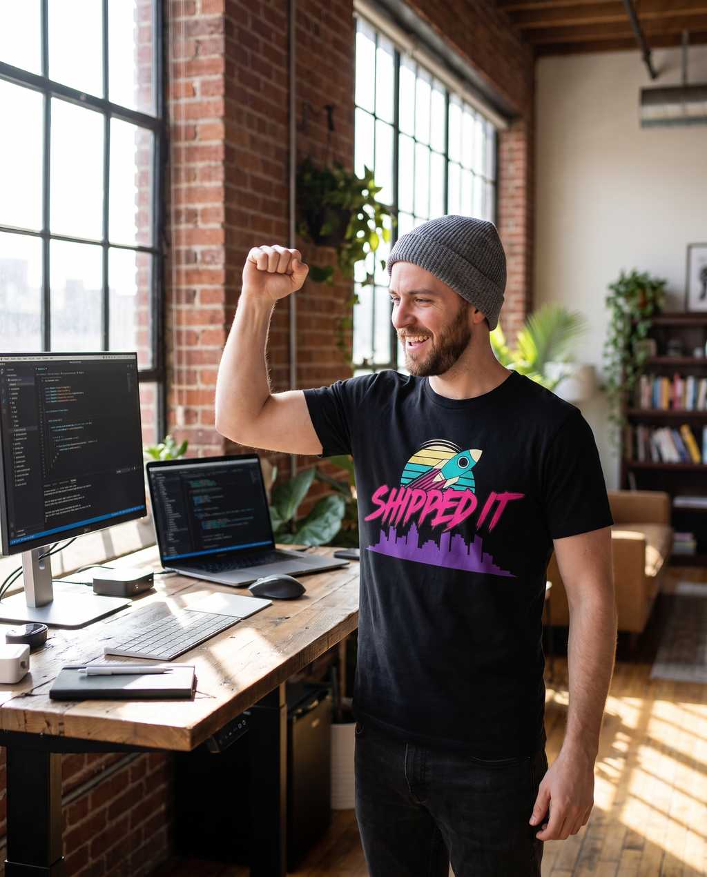 SHIPPED IT tee — black, dev desk lifestyle